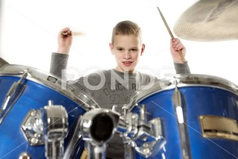 Yount blond teen boy at drum kit Stock Photos