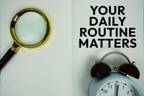 Your Daily Routine Matters text message written on note page with magnifyin.. Stock Photos
