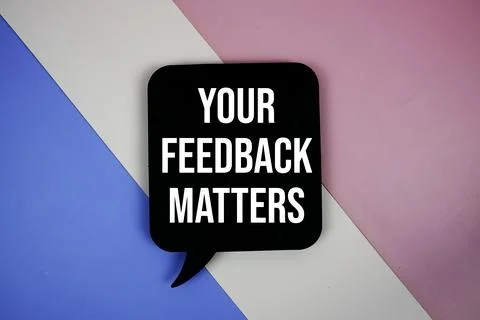 Your Feedback Matters text on speech bubble top view on purple geometric ba.. Stock Photos