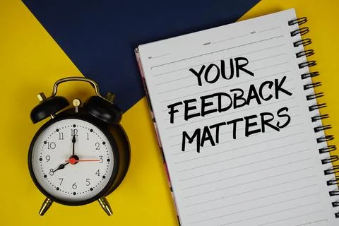 Your Feedback Matters text written on notepad with alarm clock on yellow ba.. Stock Photos