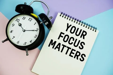 Your Focus Matters text written on notepad with alarm clock flat lay on mul.. Stock Photos
