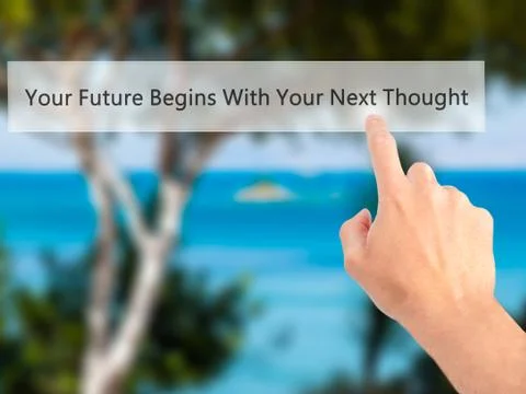 Your Future Begins With Your Next Thought - Hand pressing a button on blurred Stock Photos