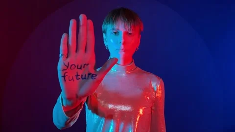 Your future in your hands written on female palms in colorful light Video stock 239607582