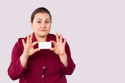 Your message may be here. Pretty young excited overweight woman is holding a  Stock Photos