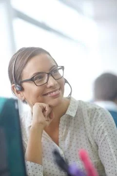 Your needs are our priority. an attractive young customer service representative Stock Photos