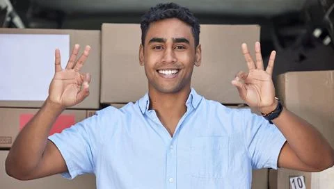 Your parcel is in safe hands with me, I promise. Portrait of a young delivery 写真素材