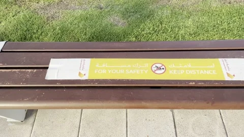 For your safety keep distance wrote on bench Stock Footage 233857335