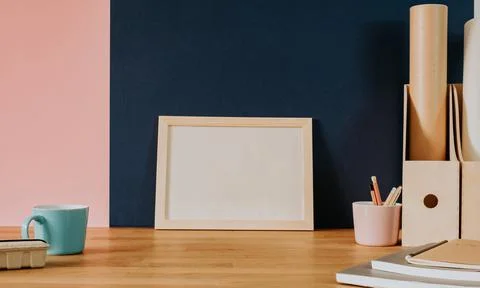 Your text here - empty frame on wooden desk Stock Photos