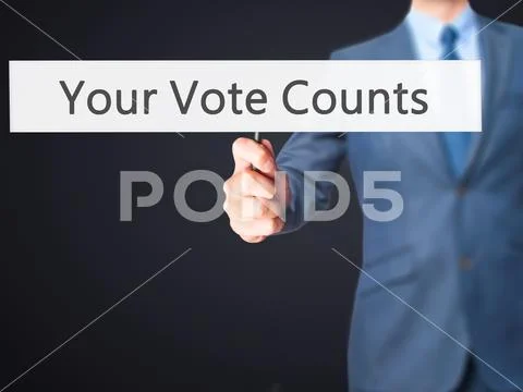 Your Vote Counts - Business man showing sign Stock Photos