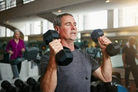 Your willpower is all that matters not age. a senior man working out with Stock Photos