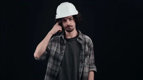 You're crazy. The engineer with the white helmet points with his index finger Stock Footage 156278251