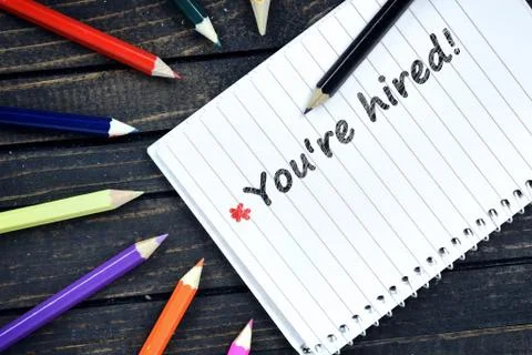 You're Hired text on notepad Foto stock