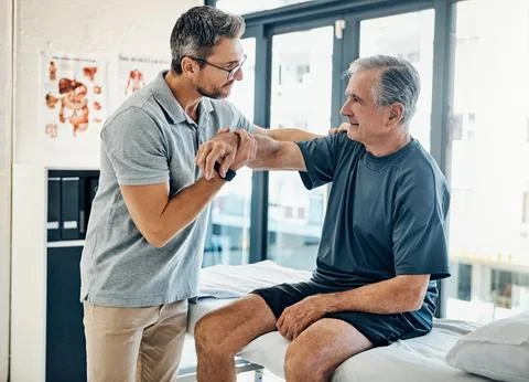 Youre mobility just keeps improving. a skilled physiotherapist testing his Stock Photos