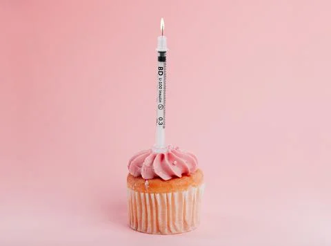 Youre only one cupcake away from diabetes. Closeup shot of a needle on a cupcake Stock Photos