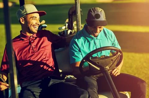 Youre setting yourself up for failure against me. two golfers riding in a cart Stock Photos