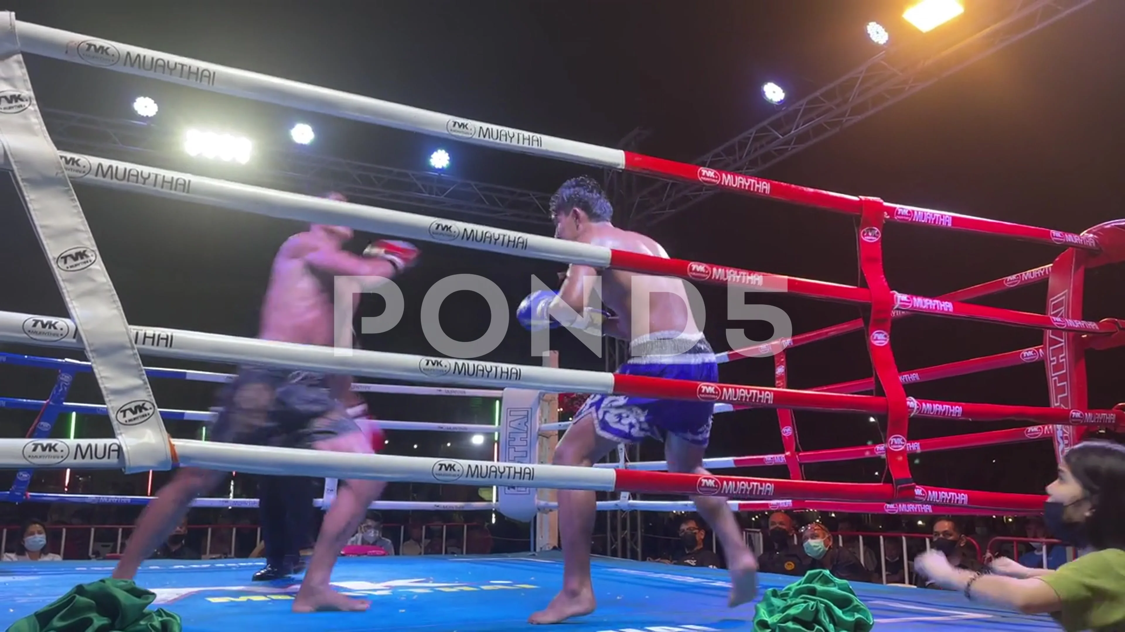 Youth amateur Muay Thai Boxing match kick punch knee and elbow attacking
