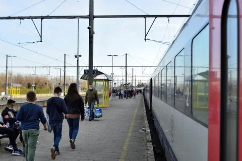 Youth from backside taking the train Stock Photos