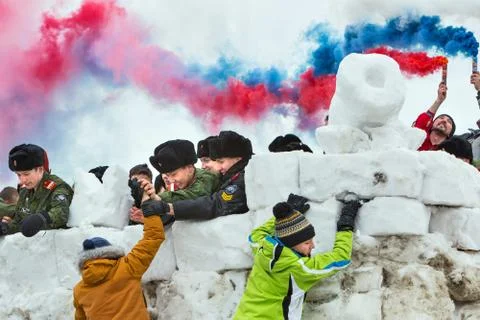 Youth in the game -Taking a snow town . Western Siberia, Russia Stock Photos
