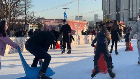 Youth Ice Skating At Sofia Christmas Fest While Parents Watch From Side 스톡 동영상 324515655