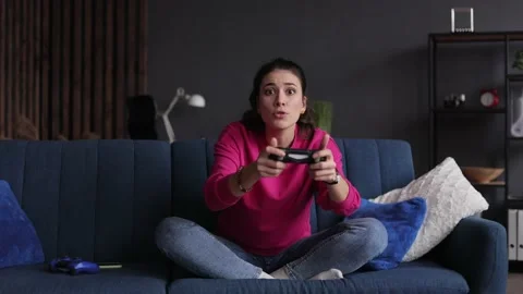 Youth millennial lifestyle and technology concept. Young woman playing game Stock Footage 166364464