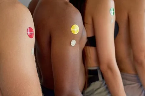 Youth standing in line, in queue after vaccination. indoors. side view, close-up Stock Photos