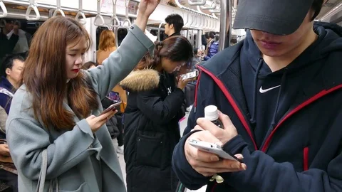 Youth Using Smartphone On Subway Train In Seoul Korea Asia Stock Footage 73443545