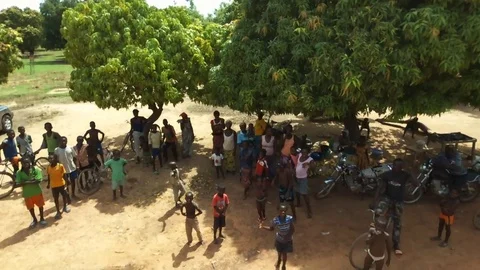 Youth at a village crossroad Stock Footage