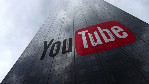 YouTube logo on a skyscraper facade reflecting clouds, time lapse. Editorial 3D Stock Footage 81111843
