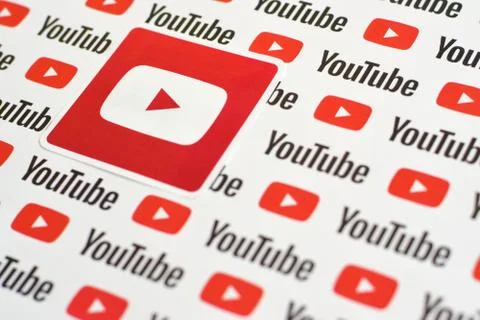 Youtube logo sticker on pattern printed on paper with small youtube logos and Stock Photos