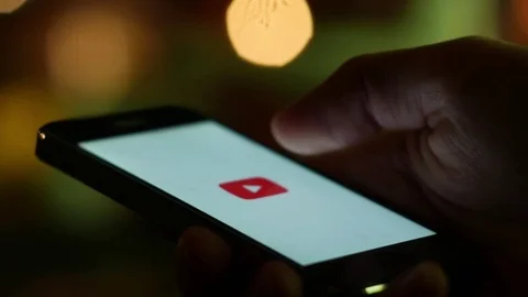 Youtube videos browsing and watching from a smartphone app Stock Footage