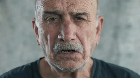 An youtuber old man speaking to camera. Technology and elderly senior person  Stock Footage 132972899