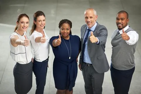 Youve got our backing. High angle portrait of a group of businesspeople pulli Foto stock