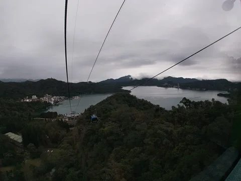 Yuchi, Taiwan – 2019, Dec 30: Sun Moon Lake Ropeway Over Mountain Forest Stock Footage 345253170