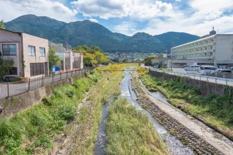 Yufuin village, river, Yufu mountain and blue sky with cloud background, Yufu Stock Photos