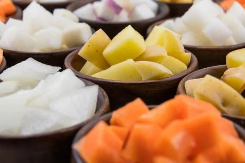 Yukon Gold Potato Cubes in Array of Root Vegetables Stock Photos