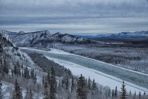 The Yukon River is full of ice chunks as it drift by Eagle Rock, near Carmacks, Stock Photos