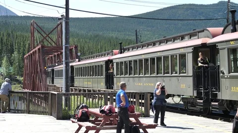 Yukon White Pass Train Going Over Railroad Bridge Arriving in Carcross Stock Footage 80743545