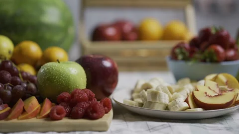 Yummy sliced fruit on kitchen counter - closeup tracking shot Stock Footage 341216237