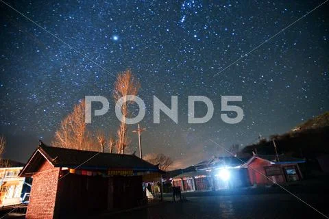 Yunnan, china, a village in the sky under the stars. Stock Photos