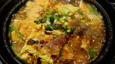 Yunnan-style beef and egg rice noodles in a steaming pot Stock Footage 342282948