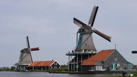 Zaanse Schans, Netherlands, 2 windmills spinning in the wind Stock Footage 60980940