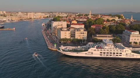 Zadar – Evening Drone Slide Over Harbour, Ferry, Old Town &amp; Greetings to the Sun Vídeo Stock 341658670