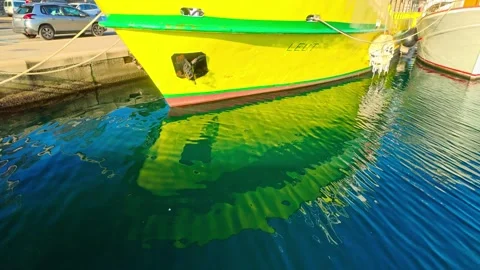 Zadar – Yellow Leut Docked at Old Town With Reflections and Street Activity Stock Footage 340340242
