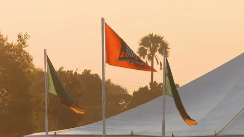 Zambian flags at dusk Stock Footage 142369304