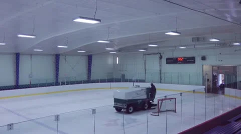 Zamboni Resurfacing An Indoor Ice Rink Between Hockey Games Stock Footage