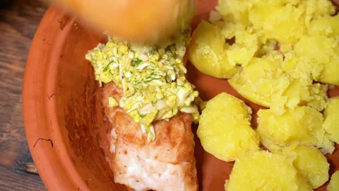 Zander fillets with potatoes on a plate Stock Footage 253564692