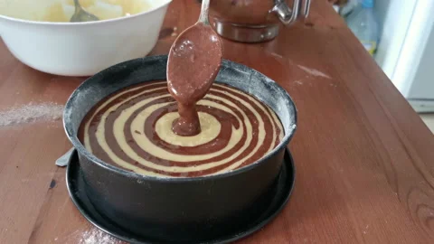 Zebra cake. Process of elaboration by pouring the mixture into the mold. Video stock 155817771