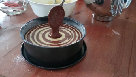 Zebra cake. Process of elaboration by pouring the mixture into the mold. Video stock 155818112