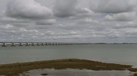 Zeeland Bridge, crossing the Eastern Scheldt (Oosterschelde) + pan tidal estuary Stock Footage 51571103