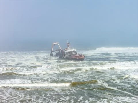 Zeila Shipwreck stranded in the rough ocean waves in Namibia Stock Photos